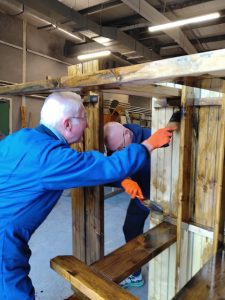 Lagan Valley & Enniskillen Rotary Club painting picnic benches at Share Discovery Village, Co Fermanagh, N Ireland